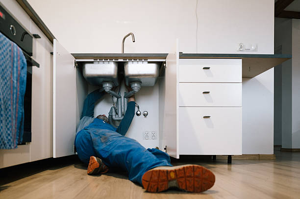 Professional Emergency Plumber technician working in Whitewater, WI